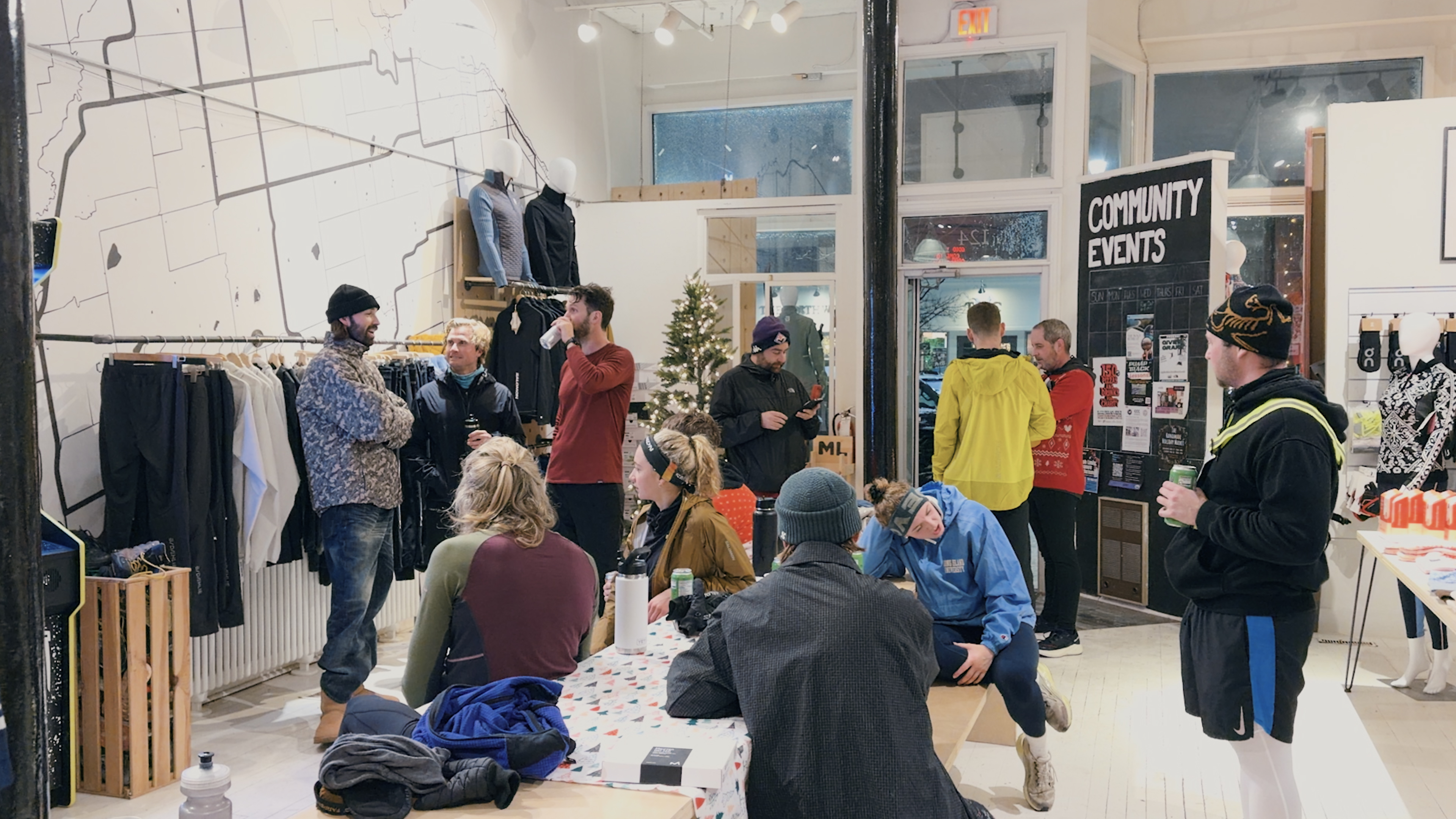 Community gathering at local shop before the run